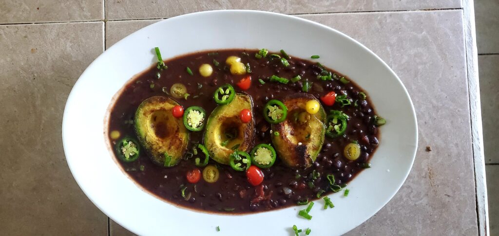 Black bean soup with avocado and peppers.