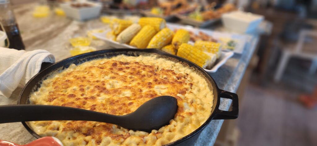 Cheesy macaroni and cheese in a pan.