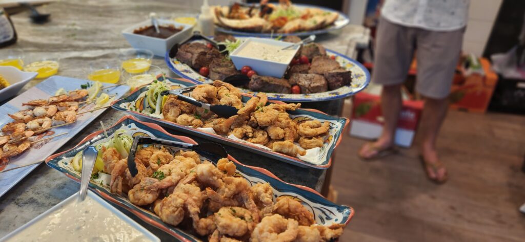 Two plates of fried shrimp on a table.