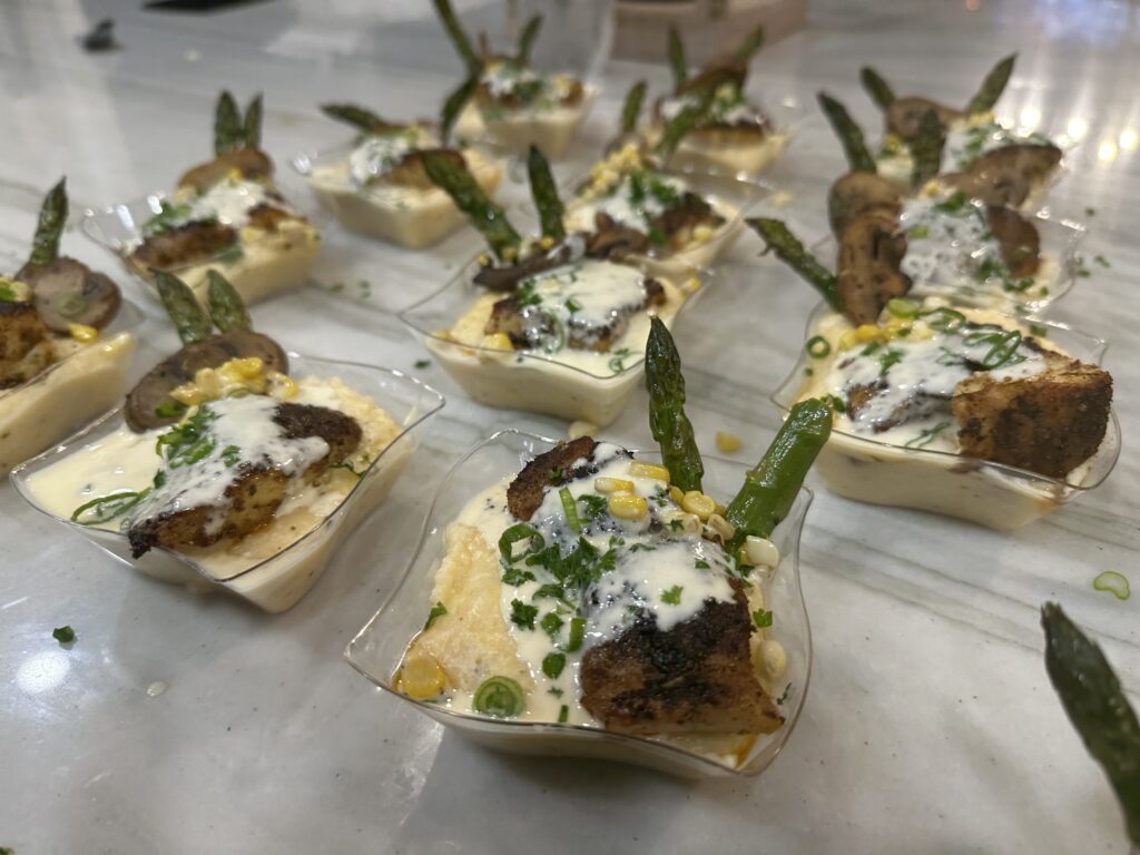 A table with many small cups of food on it