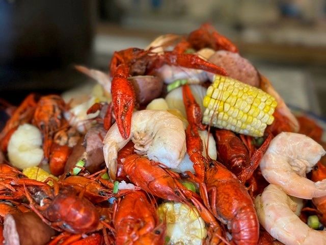 Spicy crawfish boil with corn.